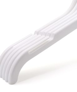 Closeup group photo of 5 white plastic clothes hangers with notches